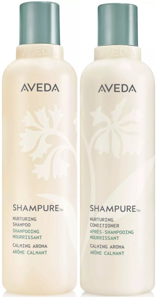 Zwei Flaschen Aveda nährendes Shampoo und Conditioner mit beruhigendem Aroma und grünen Kappen.