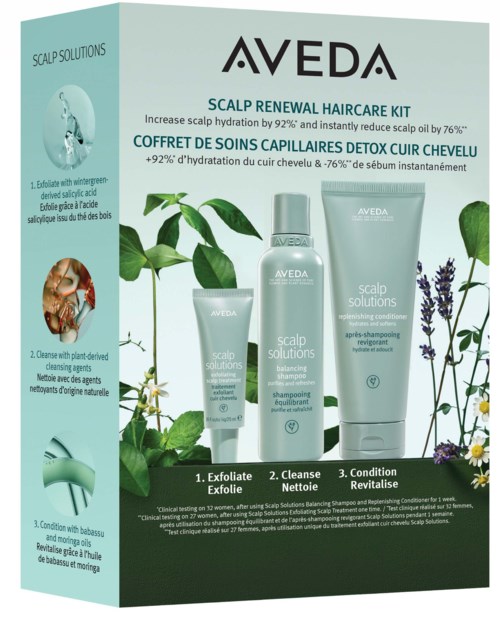 Aveda Haarpflegeset mit Flaschen, grünen Blättern, Lavendel und Text über Kopfhautpflege.
