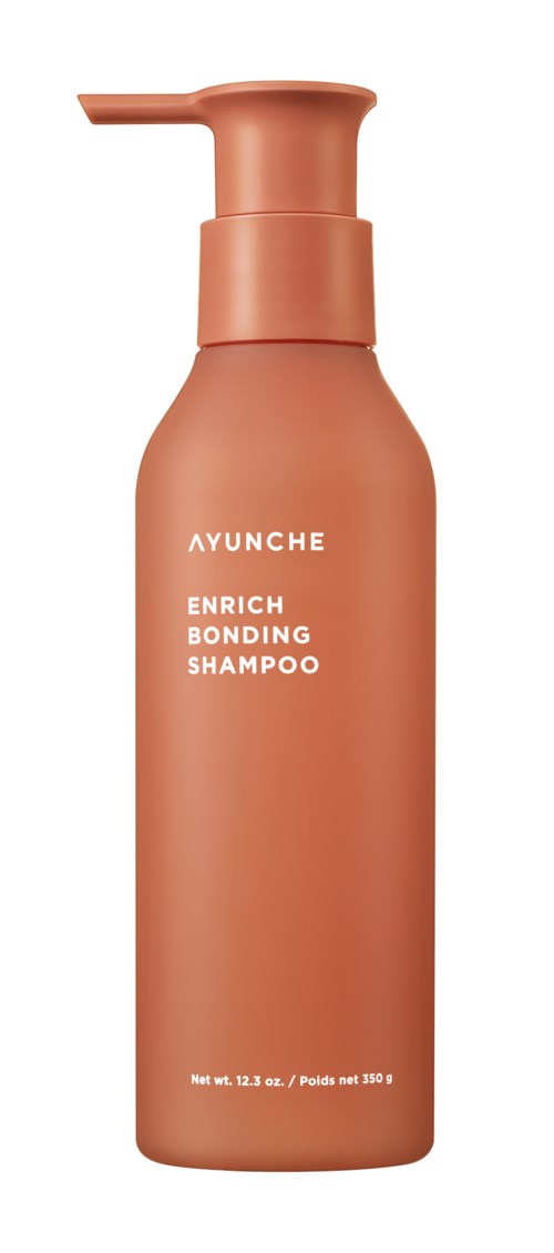 A coral-colored shampoo bottle with a pump, labeled 'AYUNCHE ENRICH BONDING SHAMPOO,' and a net weight of 13.2 oz.