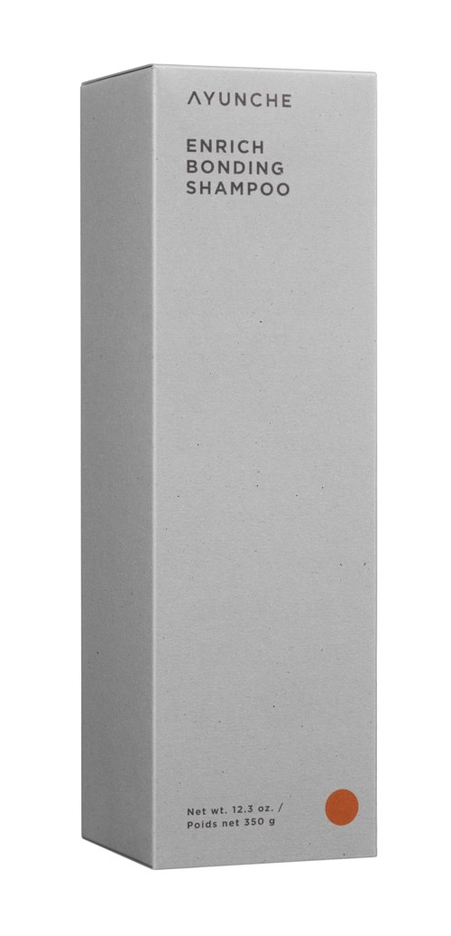 A tall, white box with black text that reads 'AYUNCE ENRICH BONDING SHAMPOO' and a small red circle at the bottom.