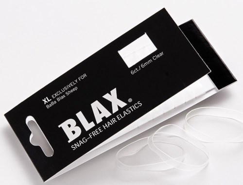Zwarte verpakking voor XL doorzichtige haar elastiekjes, met witte tekst en enkele elastiekjes zichtbaar. Label zegt dat het voor Bash Bash Sheep is.