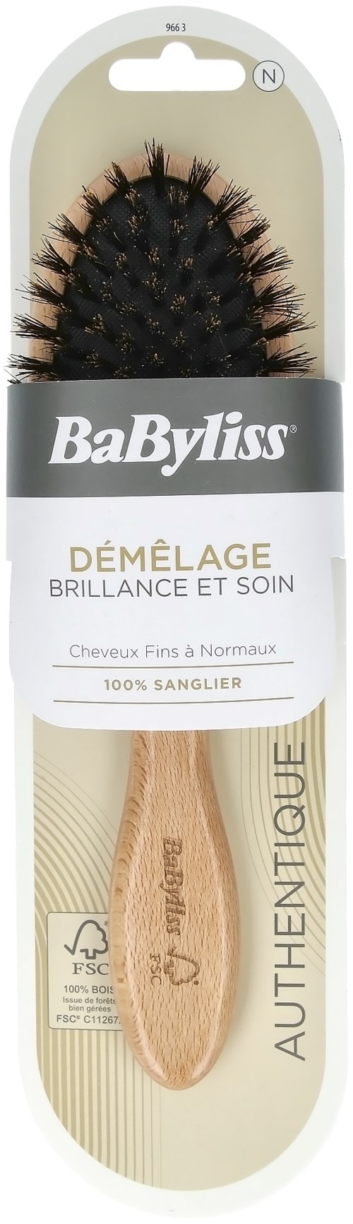 A hairbrush with a wooden handle and black bristles, in packaging labeled "BaByliss" and "Démêlage."
