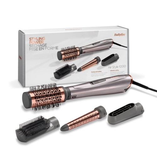 A hair styling tool with multiple attachments, including a brush and a flat iron, on a white box.