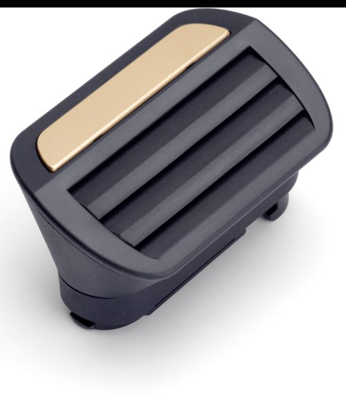 A foot pedal with a black body, gold accent, and three ridges for foot grip.