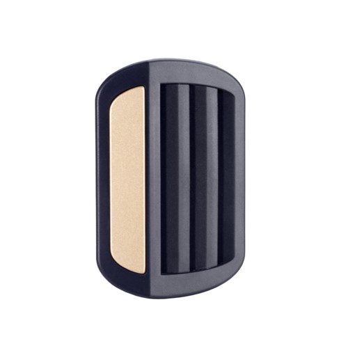A black plastic device with a beige side and black ridges, likely a personal grooming tool or appliance.