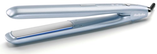 A silver hair straightener with a closed lid and a power cord, designed for styling hair.