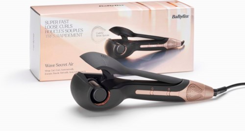 A black and gold hair styling tool with a cord, in front of its box, which has a picture of the device.