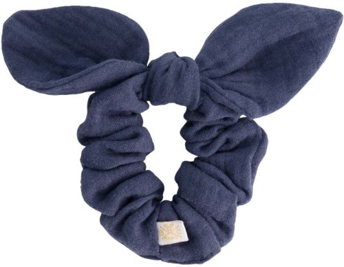 A dark blue fabric hair tie with two large, leaf-shaped fabric pieces attached, resembling bunny ears.
