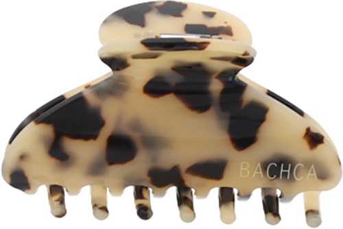 A tortoise shell patterned hair clip with the word BACHCA on it.