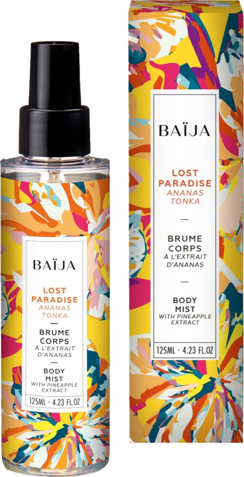 A body mist bottle and colorful packaging with abstract floral pattern and text about tropical fruit scent.