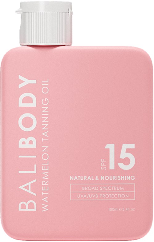 Roze fles met witte dop, gelabeld als lichaamsselbronnenolie met SPF 15, natuurlijk, voedend, breed spectrum bescherming.