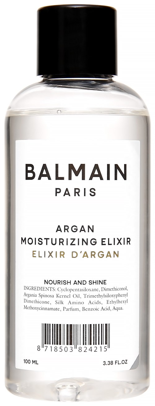 Klart flask med svart lock, märkt Balmain Argane Elixir, innehåller fuktgivande olja för huden, 100 ml.