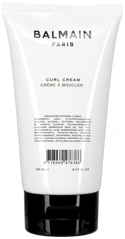 En vit tub med Balmain Paris Curl Cream och svart lock. Den betonar hårlock.