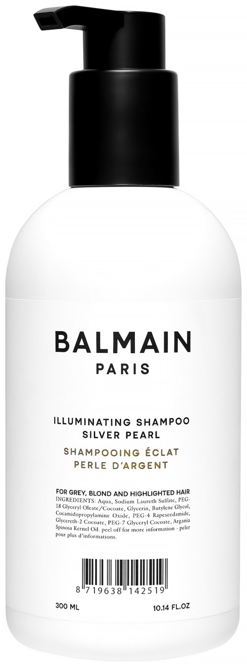 Valkoinen shampoopullo, jossa musta korkki, merkitty 'Balmain Paris Illuminating Shampoo Silver Pearl.'