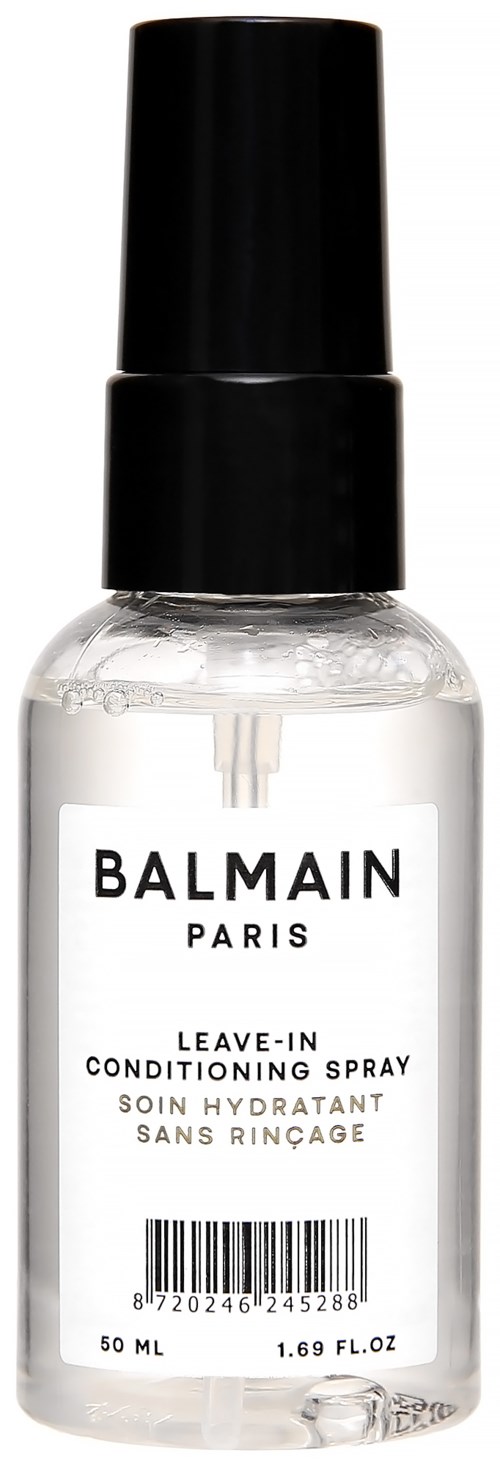 En klar sprayflaska med svart lock, märkt Balmain Paris, för leave-in balspray.