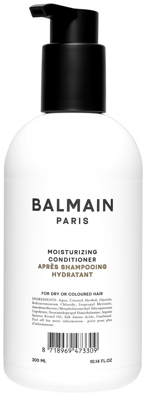 Valkoinen pullo mustalla pumpulla, merkiltä Balmain Paris, kosteuttava hoitosampoo kuiville tai värjätyille hiuksille.