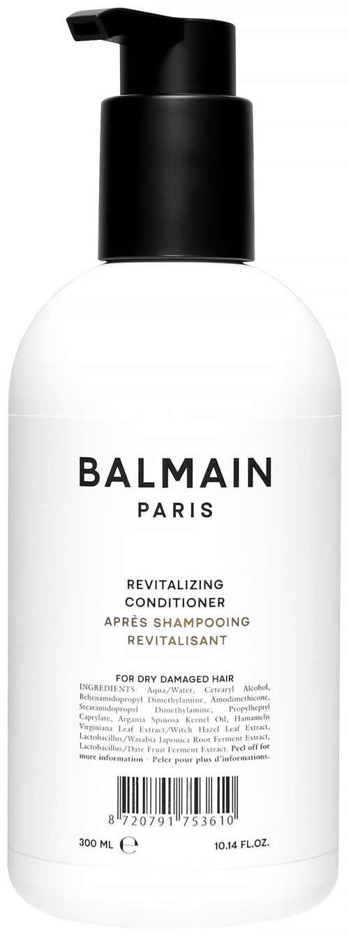 Valkoinen pullo, jossa musta pumppu, merkintä Balmain Paris, elvyttävä hoitoaine kuivalle vahingoittuneelle hiukselle.