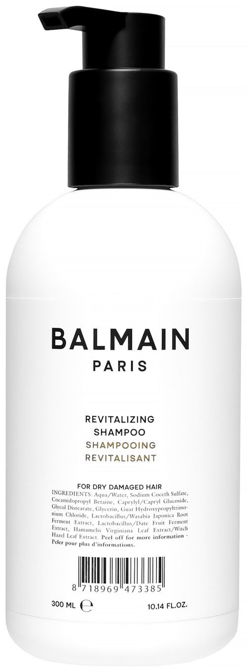 Valkoinen pullo mustalla pipetillä, joissa lukee 'Balmain Paris', kosteuttava shampoohon kuivalle hiuksille.