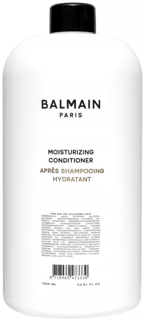 Valkoinen pullo mustalla korkilla, merkinnässä 'Balmain Paris' ja 'Moisturizing Conditioner'.