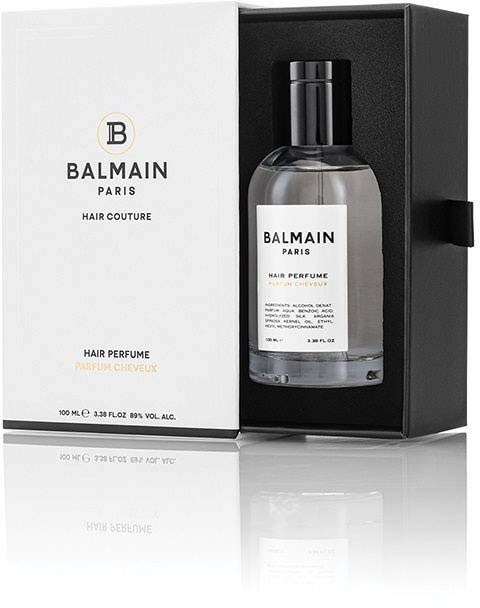 A perfume bottle with packaging, labeled with Balmain Paris, inside a box.