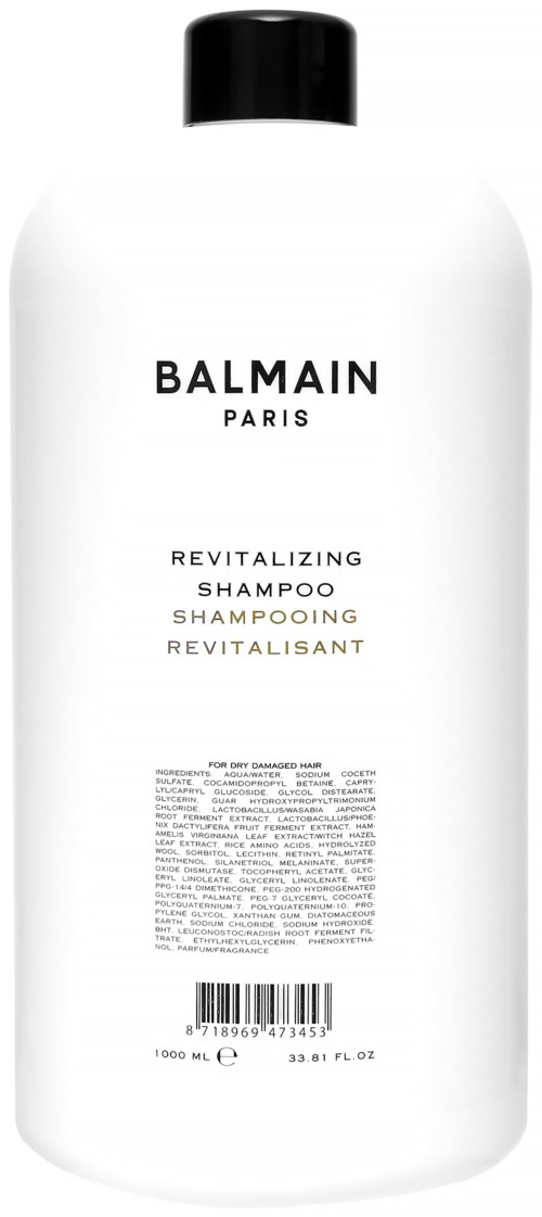 Valkoinen pullo Balmain Paris Revitalizing Shampoo, musta kansi, yksinkertainen etiketti ja pieni teksti.