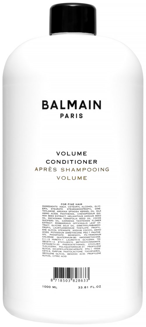 Valkoinen pullo mustalla korkilla, merkintä 'Balmain Paris Volume Conditioner' ja pieni teksti.