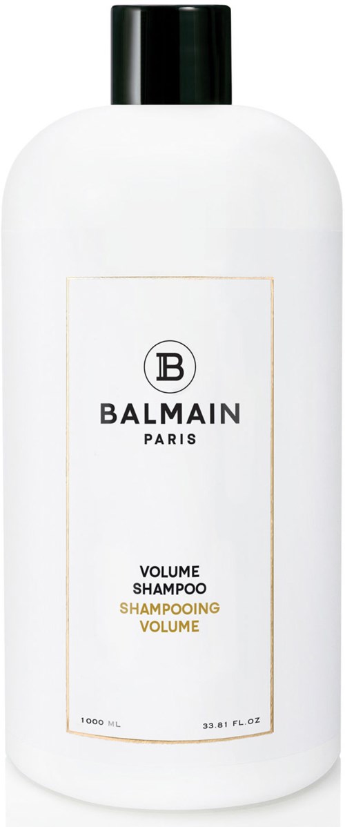 Valkoinen Balmain Paris -pullo, jossa musta korkki ja etiketti, sisältää shampoota.