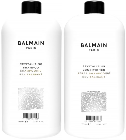 Kaksi valkoista pulloa, joissa on mustat korkit, merkinnältä Balmain Paris, vaikutusvaikutteinen shampoo ja hoitoaine, 1000 ml per kappale.