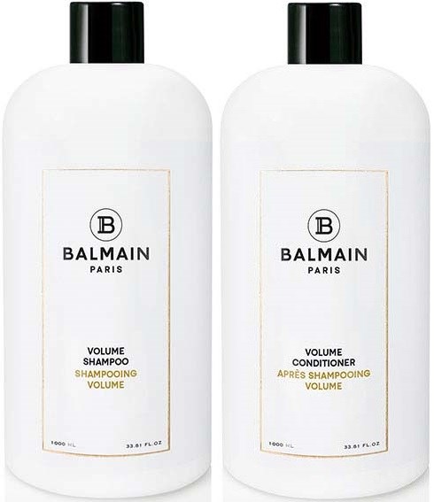 Kaksi valkoista pulloa mustilla päillä, merkinnässä Balmain Paris, shampoota ja hoitoainetta, volyymille.