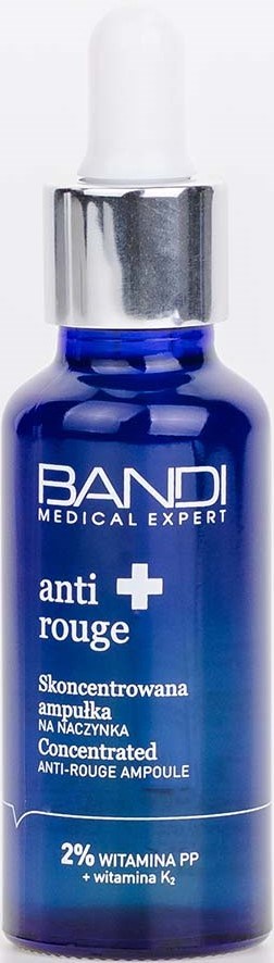 Blå flaske med pipettekork, merket som anti-rødhets serum med vitaminer og ingredienser.