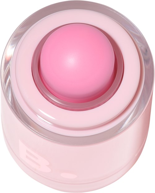 Een roze, ronde apparaat op een doorzichtig standaard, mogelijk een schoonheids- of huidverzorgingsapparaat.