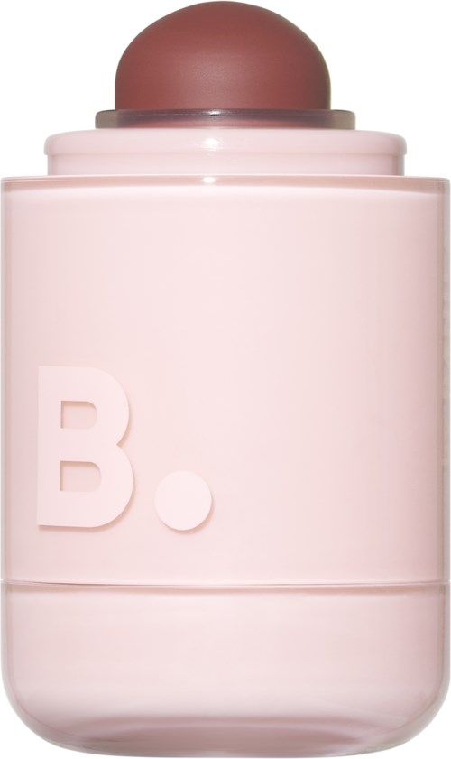 A pink container with a round brown cap and a large letter B on it.