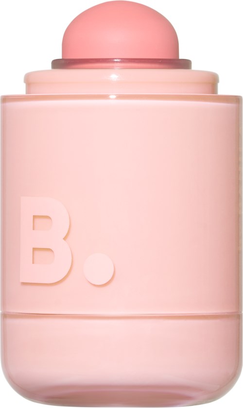 A pink round container with a large letter B and a dot on the front. It looks like a cosmetic or perfume bottle.