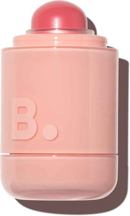 Pink cylindrical bottle with a rounded top and a large letter B. It looks like a perfume or cosmetic container.