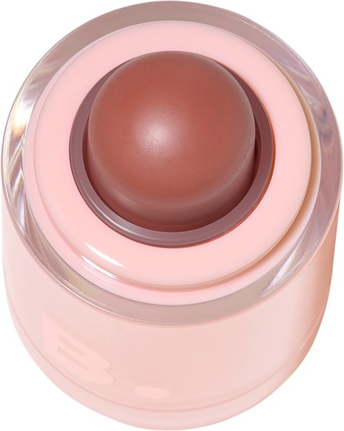 Een ronde, bruine make-upproduct in een roze container met doorzichtige deksel.