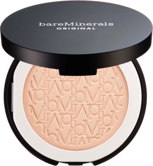A compact with a black lid and round shape, containing peach-colored powder embossed with letters. Logo on top.