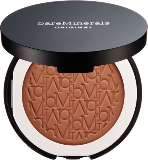A round makeup compact with a black lid and a pattern of the word 'LOVE' embossed on peach-colored powder.