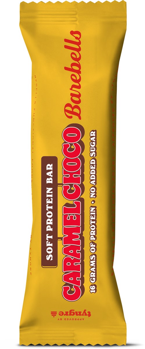 A yellow protein bar wrapper with red and black text. It says 'Caramel Choco' and 'Soft Protein Bar.'
