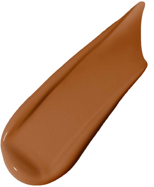 A spoon of brown or caramel-colored, creamy substance, possibly chocolate or caramel sauce.