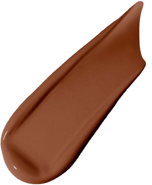 A dollop of brown creamy spread, smooth and elongated, on a white background.