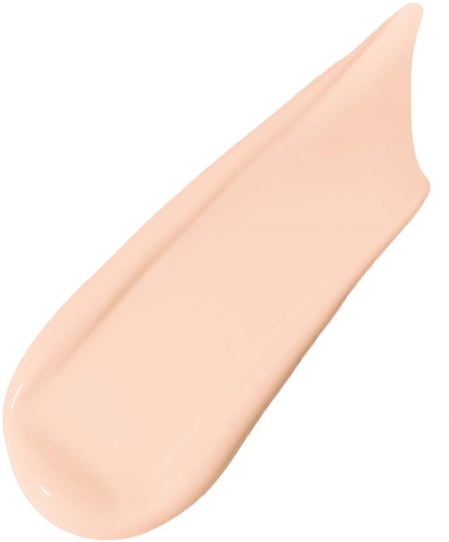A light beige cream is spread out in a smooth, curved shape on a white background.