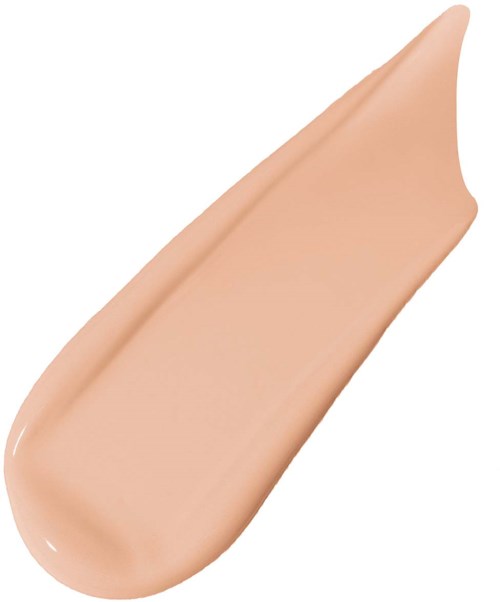 A beige or skin-colored liquid foundation smear with a pointed tip.
