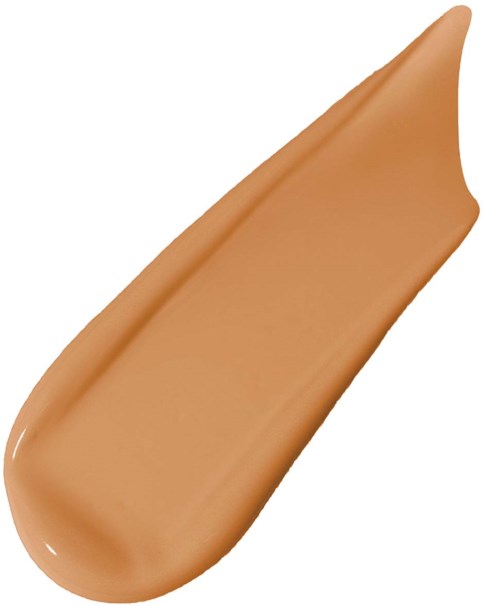 A tan-colored makeup foundation smear with a pointed tip.