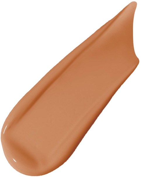 A smear of beige-colored makeup or foundation with a pointed end on a white background.