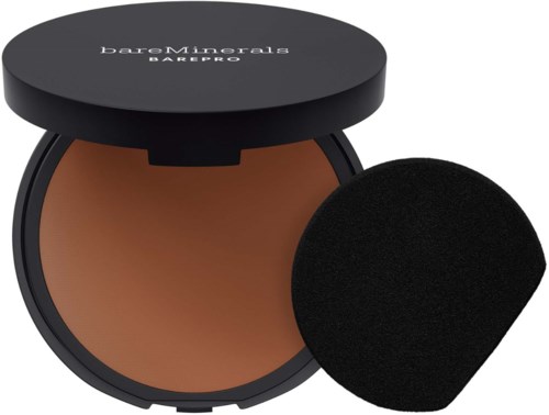 A compact of BareMinerals powder foundation with a sponge applicator.