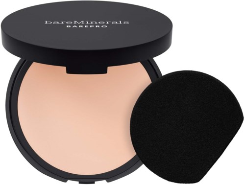 A compact powder with a black lid and a round applicator sponge.