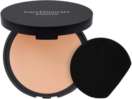 A compact powder with a black lid and a separate applicator sponge. The brand is BareMinerals BAREPRO.