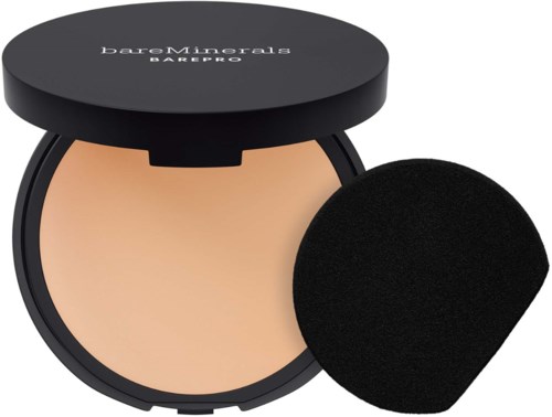 A compact with beige powder and a black applicator sponge from BareMinerals BarePro.
