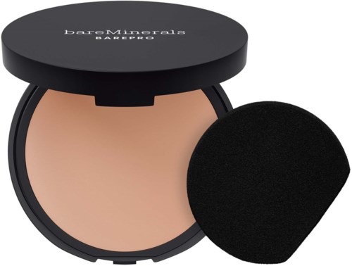 A compact powder case with a sponge applicator inside, labeled BareMinerals BAREPRO. The case is black with a logo on the lid.