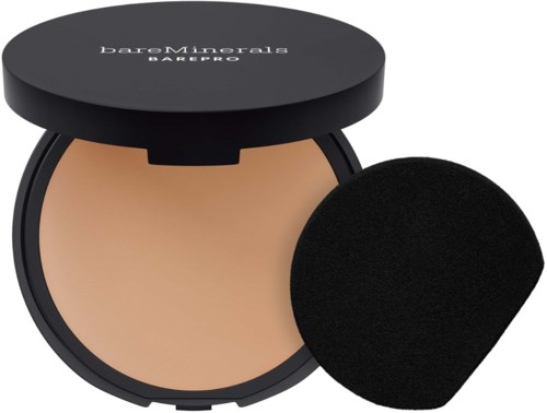 A compact with beige powder and a black applicator sponge from BareMinerals. The compact is open, showing the makeup inside.